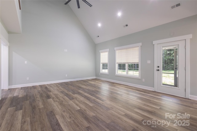5009 Oconee Dr, Stanley, NC 28164 - unfurnished living room with high vaulted ceiling, wood finished floors, ceiling fan, and recessed lighting