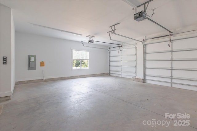 5009 Oconee Dr, Stanley, NC 28164 - garage with a garage door opener and electric panel