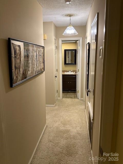 1678 Robins Nest Ct Unit B, Gastonia, NC 28054 - hallway with light colored carpet and a textured ceiling