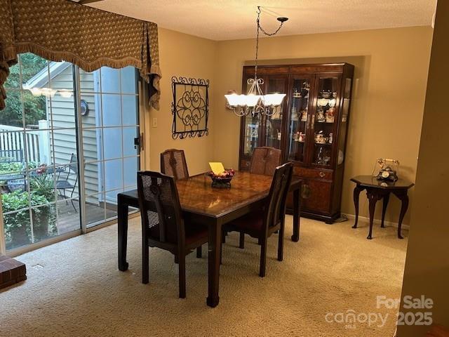 1678 Robins Nest Ct Unit B, Gastonia, NC 28054 - dining room featuring a chandelier and light colored carpet