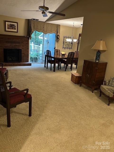 1678 Robins Nest Ct Unit B, Gastonia, NC 28054 - living room with carpet flooring, a ceiling fan, a chandelier, and a brick fireplace