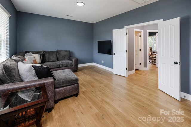 2002 Ledare Ln Unit 70, Indian Trail, NC 28079 - living area featuring light wood-type flooring and baseboards