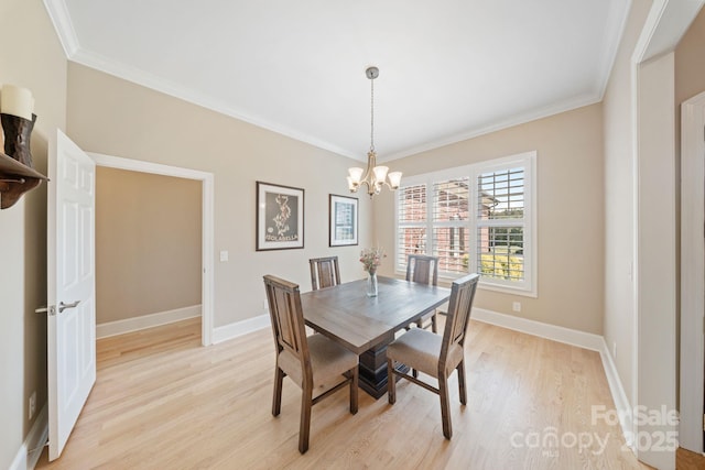 120 Cheyenne Ln, Statesville, NC 28677 - dining space with light wood-type flooring, crown molding, and a chandelier