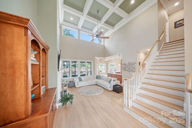 120 Cheyenne Ln, Statesville, NC 28677 - living area featuring ceiling fan, a towering ceiling, wood finished floors, beam ceiling, and coffered ceiling