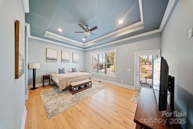 120 Cheyenne Ln, Statesville, NC 28677 - bedroom featuring a raised ceiling, wood finished floors, access to exterior, a ceiling fan, and crown molding