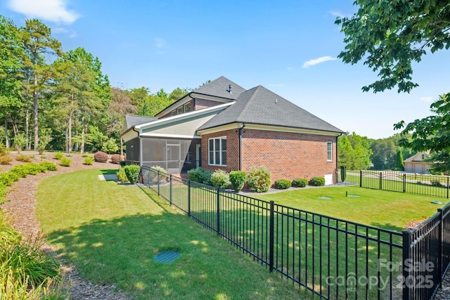 120 Cheyenne Ln, Statesville, NC 28677 - view of side of property with a sunroom, a fenced backyard, brick siding, and roof with shingles