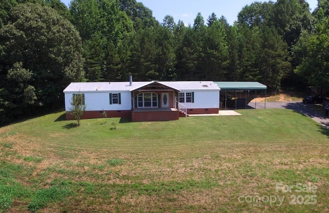 1924 Junction Rd, Mocksville, NC 27028 - manufactured / mobile home with crawl space, a front yard, a metal roof, and driveway