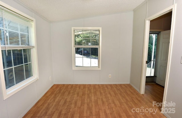 1924 Junction Rd, Mocksville, NC 27028 - unfurnished room featuring light wood finished floors, a textured ceiling, and crown molding