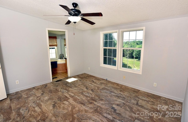 1924 Junction Rd, Mocksville, NC 27028 - unfurnished room with a textured ceiling, ceiling fan, and stone finish flooring