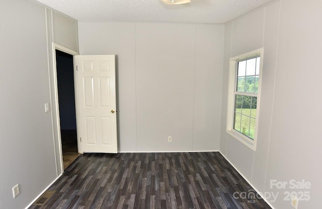 1924 Junction Rd, Mocksville, NC 27028 - spare room with a textured ceiling and dark wood-style floors