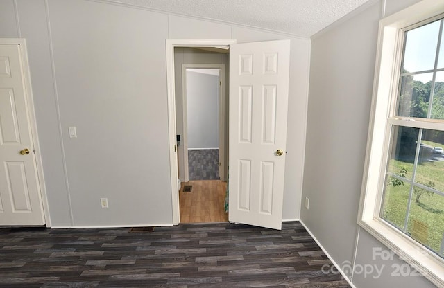 1924 Junction Rd, Mocksville, NC 27028 - empty room with dark wood-style flooring, vaulted ceiling, and a textured ceiling