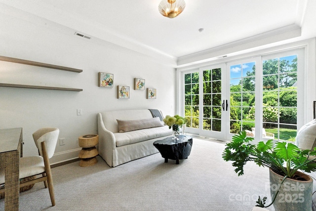 1614 Lombardy Cir, Charlotte, NC 28203 - carpeted living room featuring a tray ceiling and french doors