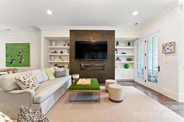 1614 Lombardy Cir, Charlotte, NC 28203 - living room with ornamental molding, wood finished floors, built in shelves, and recessed lighting