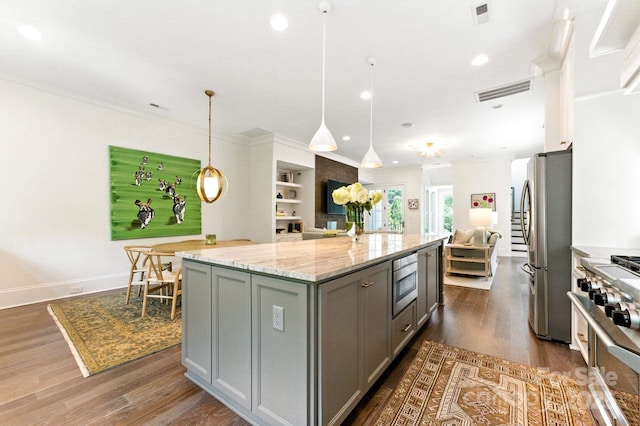 1614 Lombardy Cir, Charlotte, NC 28203 - kitchen featuring gray cabinets, open floor plan, dark wood-type flooring, stainless steel appliances, and a center island
