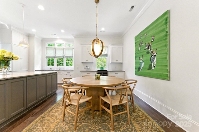 1614 Lombardy Cir, Charlotte, NC 28203 - dining room with crown molding, dark wood-type flooring, and recessed lighting