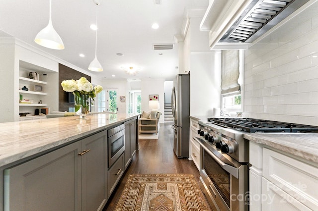1614 Lombardy Cir, Charlotte, NC 28203 - kitchen featuring stainless steel appliances, exhaust hood, light stone counters, open floor plan, and gray cabinetry