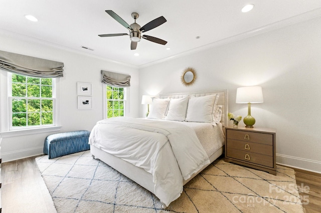 1614 Lombardy Cir, Charlotte, NC 28203 - bedroom with wood finished floors, a ceiling fan, recessed lighting, and crown molding