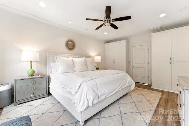 1614 Lombardy Cir, Charlotte, NC 28203 - bedroom with light wood finished floors, recessed lighting, ornamental molding, and a ceiling fan