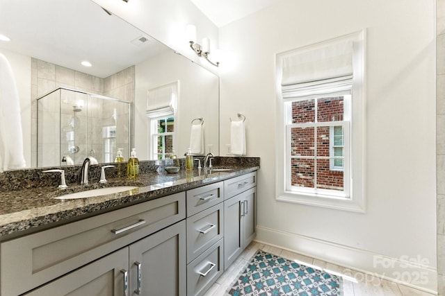 1614 Lombardy Cir, Charlotte, NC 28203 - full bathroom featuring double vanity, a stall shower, and tile patterned flooring