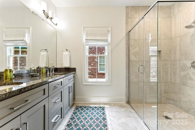 1614 Lombardy Cir, Charlotte, NC 28203 - bathroom with double vanity and a stall shower