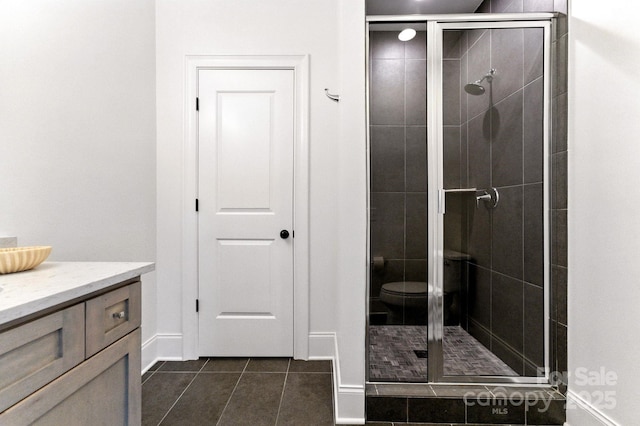 1614 Lombardy Cir, Charlotte, NC 28203 - bathroom featuring a shower stall, tile patterned flooring, and vanity