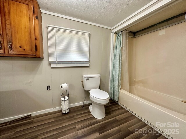 4207 Peach Orchard Rd, Granite Falls, NC 28630 - bathroom with wood finished floors and shower / bath combo with shower curtain