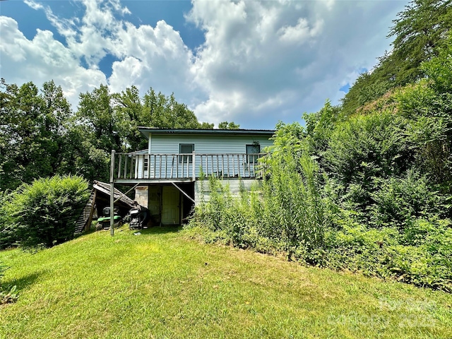 4207 Peach Orchard Rd, Granite Falls, NC 28630 - back of property with a deck, stairway, and a lawn