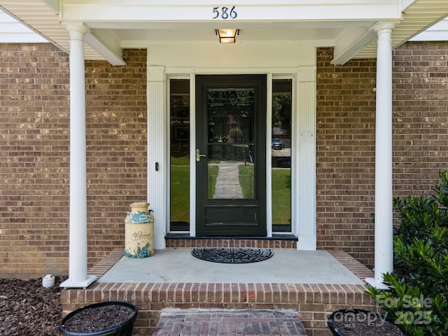 586 Crestside Dr SE, Concord, NC 28025 - doorway to property featuring brick siding