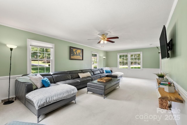 586 Crestside Dr SE, Concord, NC 28025 - carpeted living room featuring crown molding, healthy amount of natural light, and ceiling fan