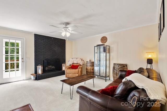 586 Crestside Dr SE, Concord, NC 28025 - living room featuring ornamental molding, carpet flooring, a ceiling fan, and a brick fireplace