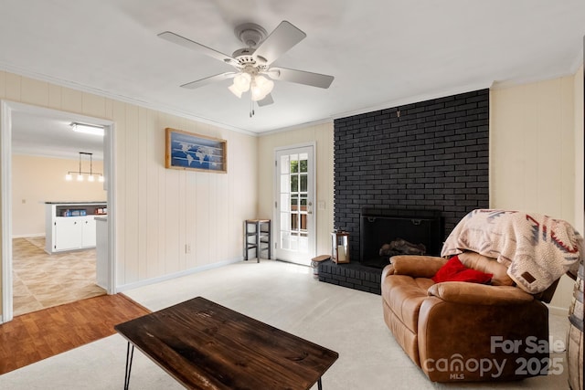 586 Crestside Dr SE, Concord, NC 28025 - living room featuring crown molding, ceiling fan, wood finished floors, and a fireplace