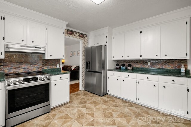 586 Crestside Dr SE, Concord, NC 28025 - kitchen featuring appliances with stainless steel finishes, under cabinet range hood, dark countertops, white cabinets, and ornamental molding