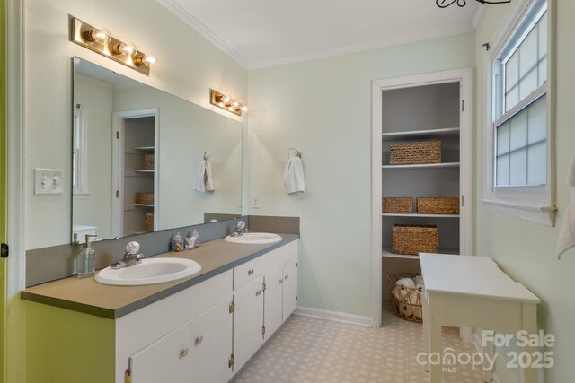 586 Crestside Dr SE, Concord, NC 28025 - bathroom featuring double vanity, tile patterned floors, and ornamental molding