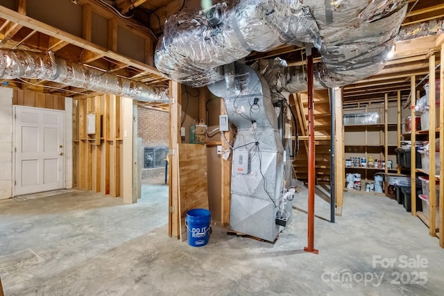 586 Crestside Dr SE, Concord, NC 28025 - unfinished basement featuring stairway and heating unit