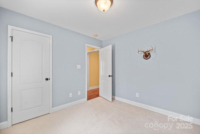 1566 Mayfair Dr, Conover, NC 28613 - unfurnished bedroom with carpet floors and baseboards