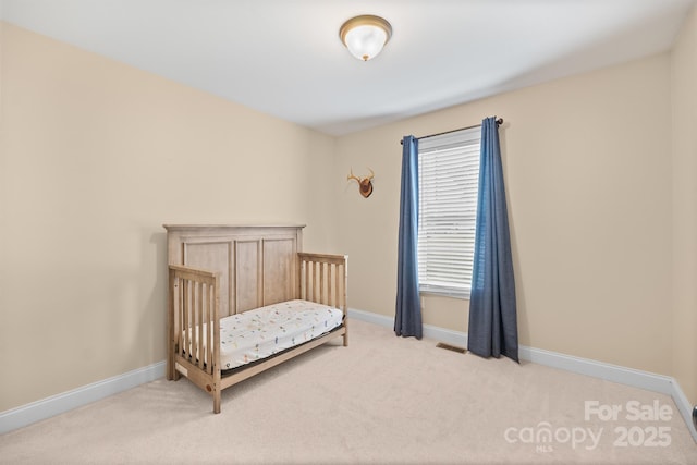1566 Mayfair Dr, Conover, NC 28613 - bedroom with carpet floors and a nursery area