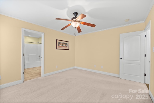 1566 Mayfair Dr, Conover, NC 28613 - unfurnished bedroom featuring light carpet, crown molding, connected bathroom, and a ceiling fan