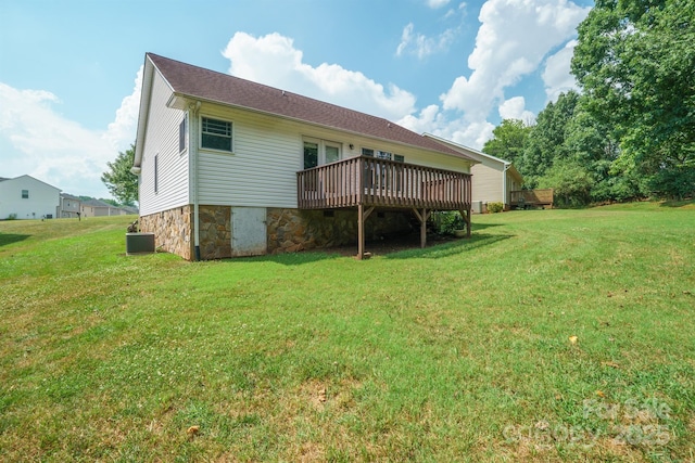 1566 Mayfair Dr, Conover, NC 28613 - back of property with a wooden deck, a lawn, and stone siding