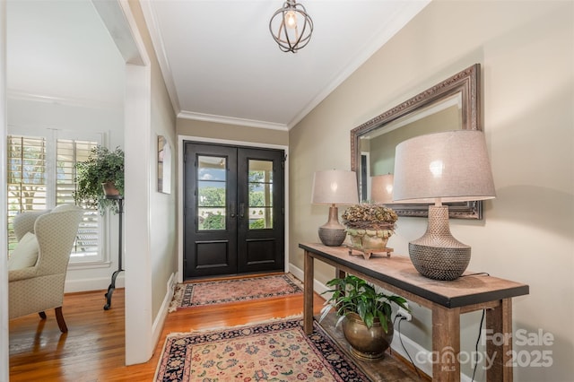 7119 Folger Dr, Charlotte, NC 28270 - foyer entrance with crown molding, wood finished floors, and french doors