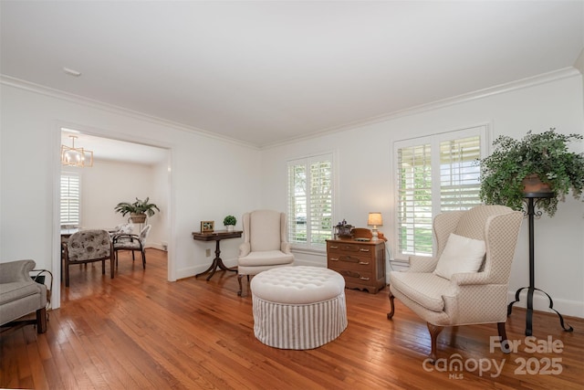7119 Folger Dr, Charlotte, NC 28270 - sitting room with crown molding, hardwood / wood-style flooring, and a chandelier