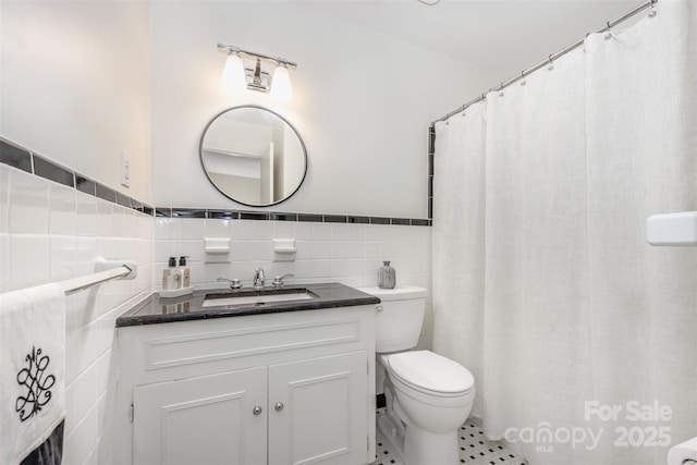 7119 Folger Dr, Charlotte, NC 28270 - full bathroom featuring tile walls, vanity, tile patterned floors, and wainscoting