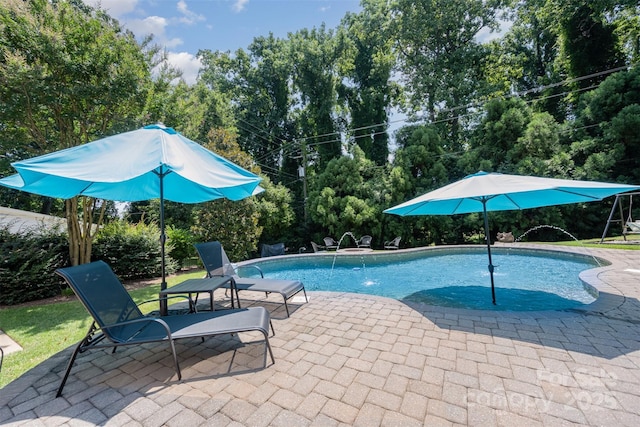 7119 Folger Dr, Charlotte, NC 28270 - swimming pool featuring a patio and view of wooded area