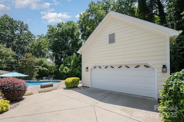7119 Folger Dr, Charlotte, NC 28270 - garage with an outdoor pool and view of scattered trees