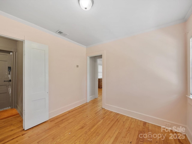 105 Edgewood Cir NE, Concord, NC 28025 - empty room featuring light wood finished floors and ornamental molding