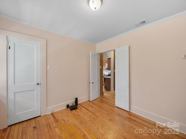 105 Edgewood Cir NE, Concord, NC 28025 - empty room with light wood-style flooring and ornamental molding