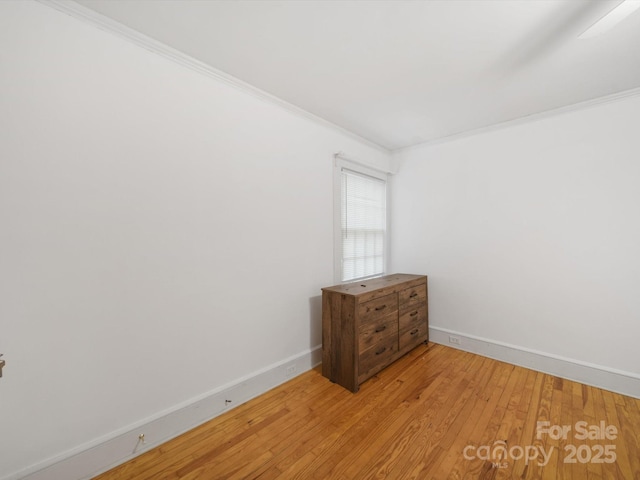 105 Edgewood Cir NE, Concord, NC 28025 - spare room featuring light wood-type flooring and crown molding