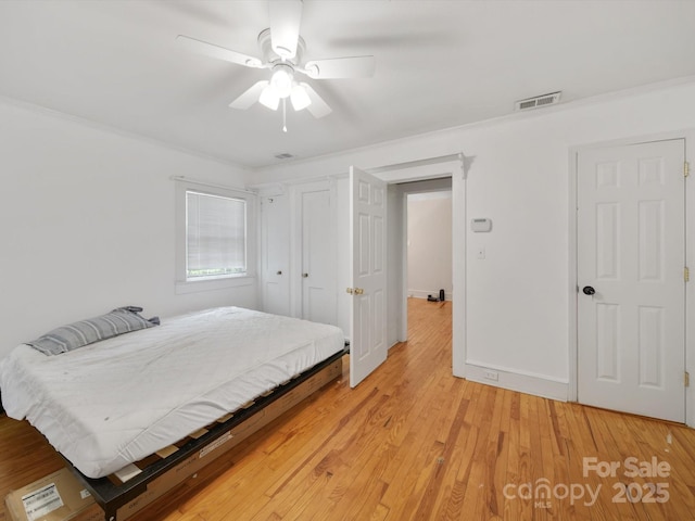 105 Edgewood Cir NE, Concord, NC 28025 - bedroom featuring light wood finished floors, ceiling fan, and ornamental molding