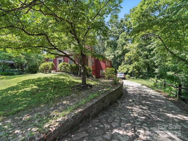 105 Edgewood Cir NE, Concord, NC 28025 - view of property exterior with a yard and driveway