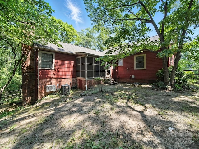 105 Edgewood Cir NE, Concord, NC 28025 - rear view of house with a sunroom and brick siding