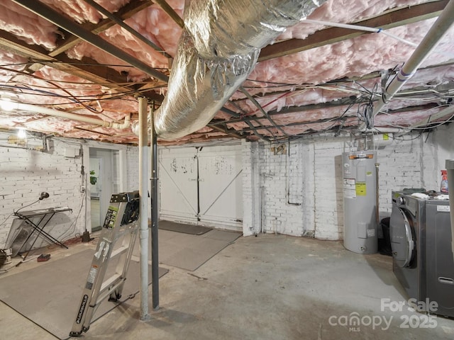 105 Edgewood Cir NE, Concord, NC 28025 - unfinished below grade area featuring electric water heater, brick wall, and washer and dryer
